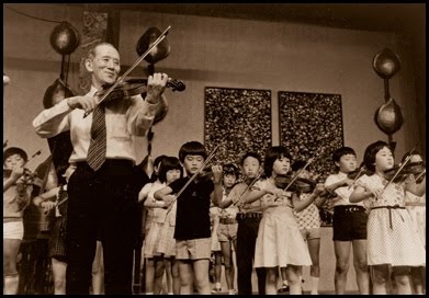 Shinichi Suzuki with a group of young Japanese violinists